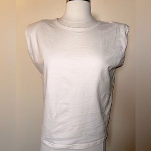 WHITE top with shoulders pads. M